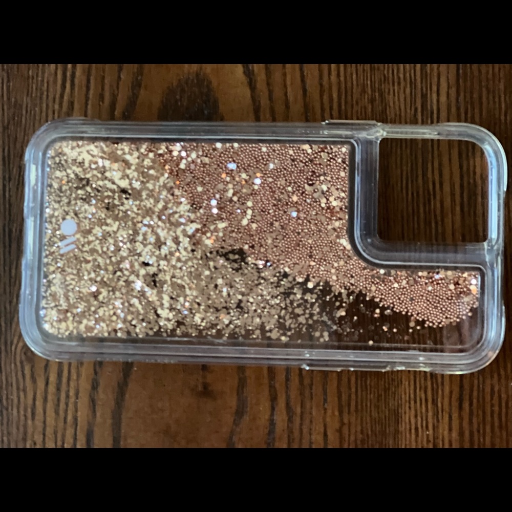 Phone case, fits iPhone 11.  Rose gold glitter in clear case.